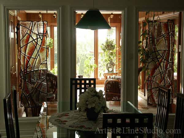 Contemporary style suspended stained, fused and leaded glass sculpture after installation