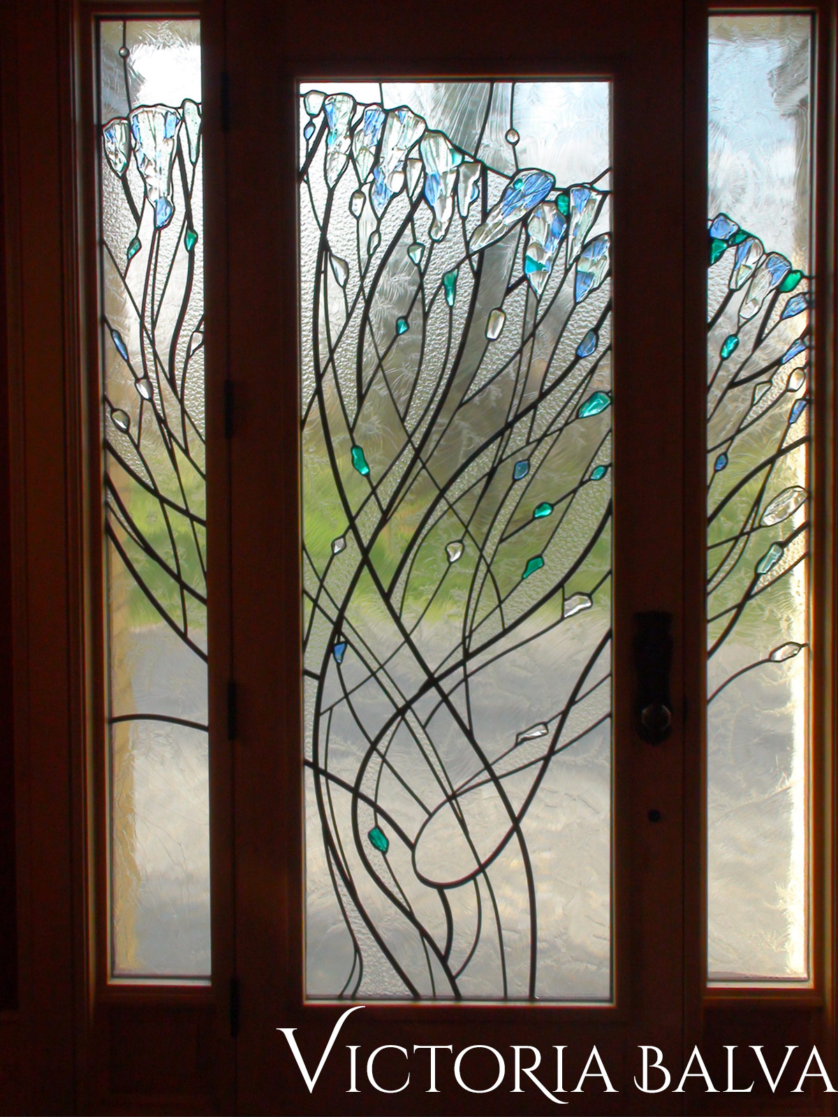 Stained, fused and leaded glass doorlights for the entrance of a private residence in London