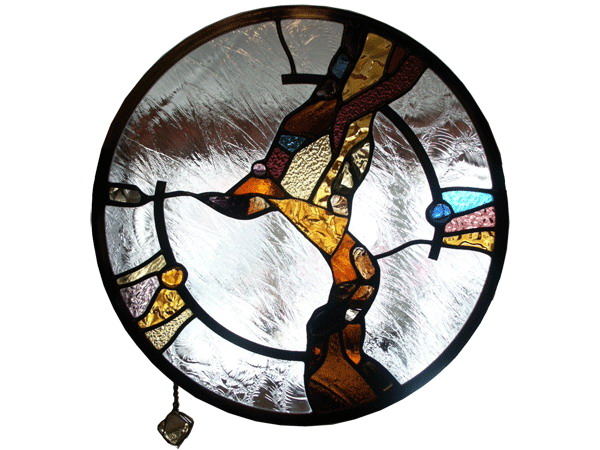 Stained and leaded glass round wall divider panel with slab glass peaces in amber tones
