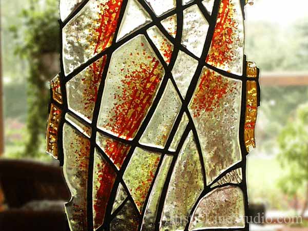 Contemporary style suspended stained, fused and leaded glass sculpture private residence close up