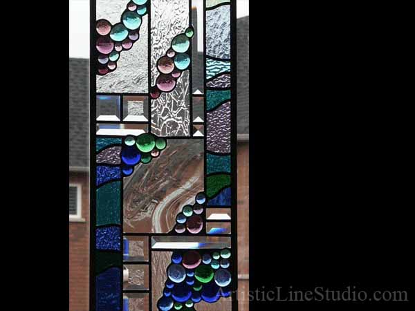  Abstract stained, beveled and leaded glass window panels with blue greem nuggets and beveled glass for a family room adding privacy and beauty
