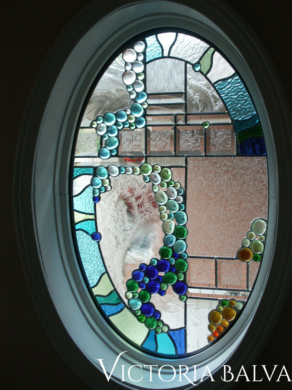Stained glass door with globes and bevels