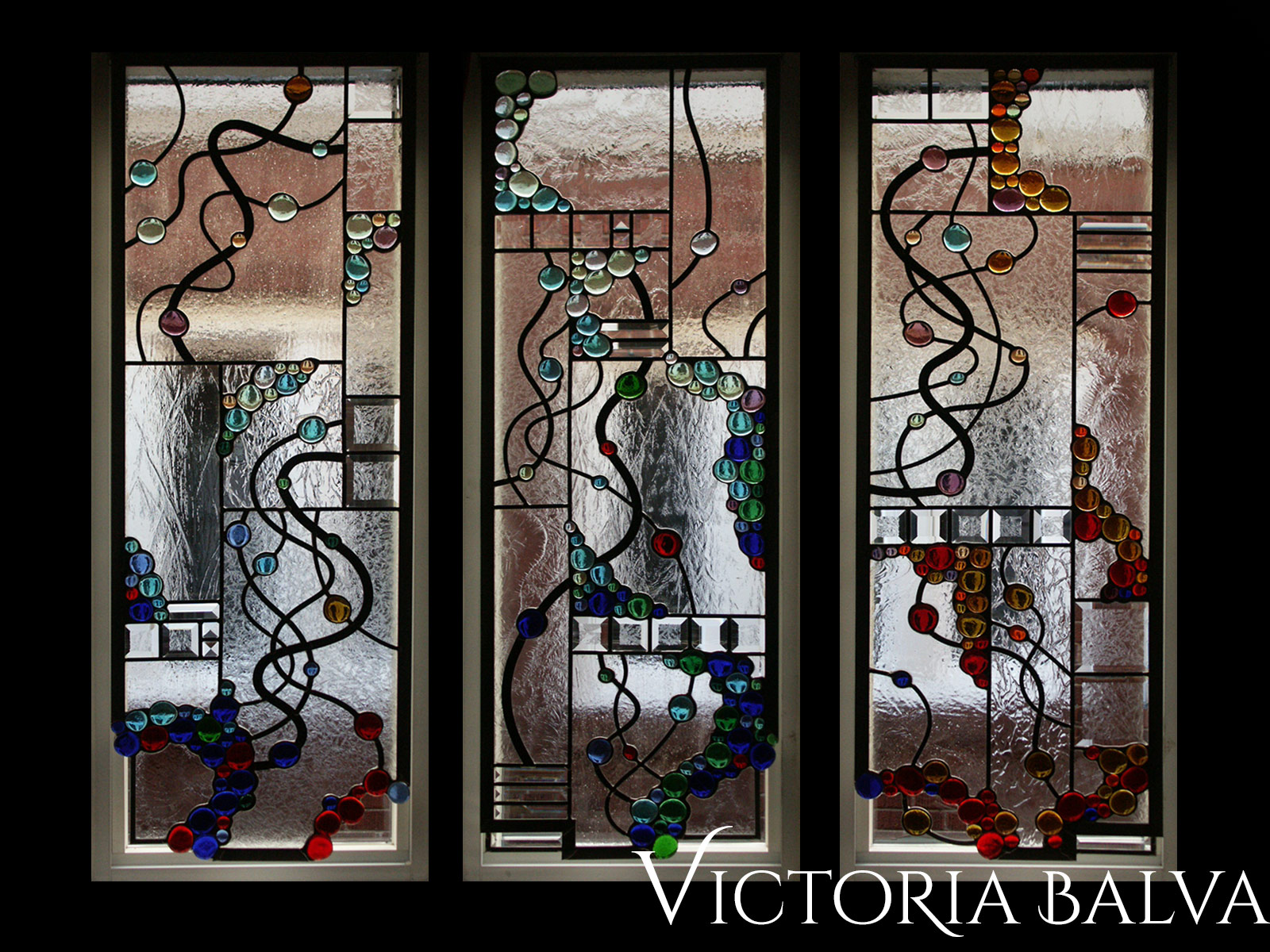 Modern style stained, beveled and leaded glass free shape suspended panels with nuggets and beveled glass