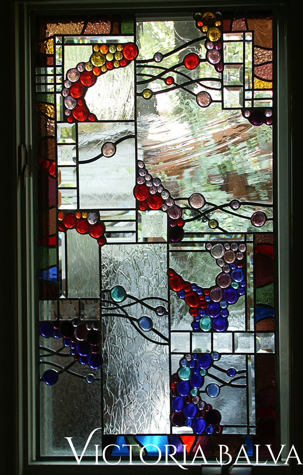 Stained leaded glass suspended panels with nuggets, French antique and bevelled glass for solarium room windows