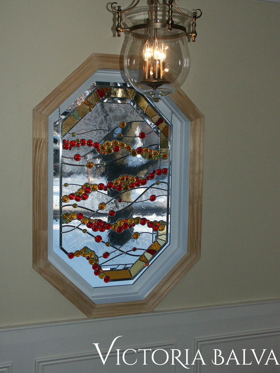 Contemporary design stained leaded glass octagon window with globes, tsunami glue chip and beveled glass for the foyer of a private residence