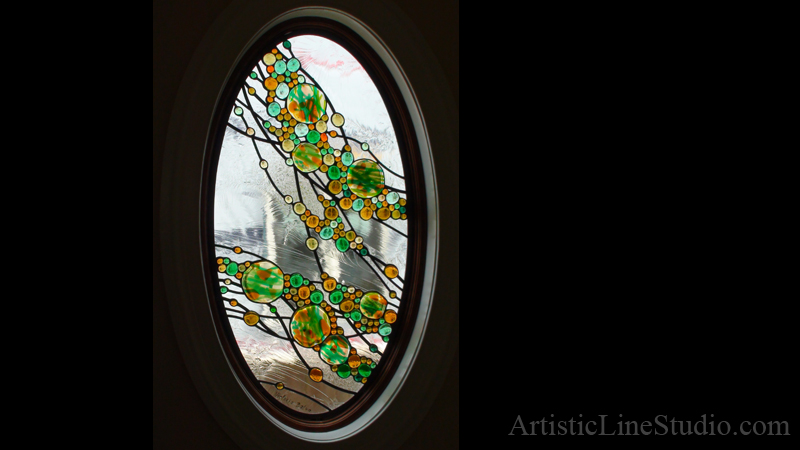 Abstract stained leaded glass oval window