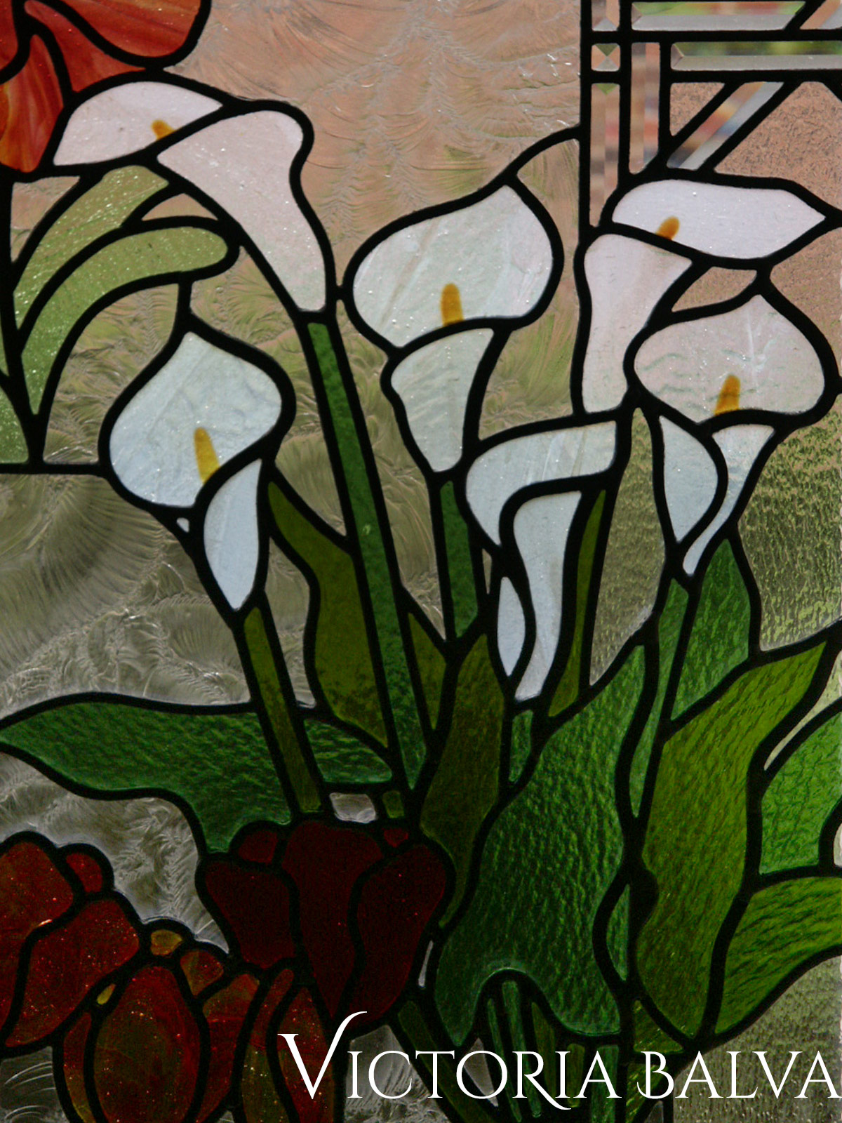 Stained leaded glass window. Flower garden. Amoralis, Tulips, Lilias. Detail with Tulips