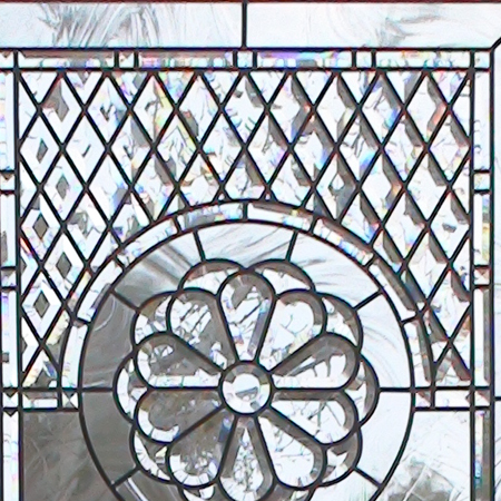 Alexei - Beveled and leaded glass window system for a family room with fireplace