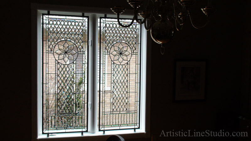  Classical beveled and leaded glass window in a daytime light