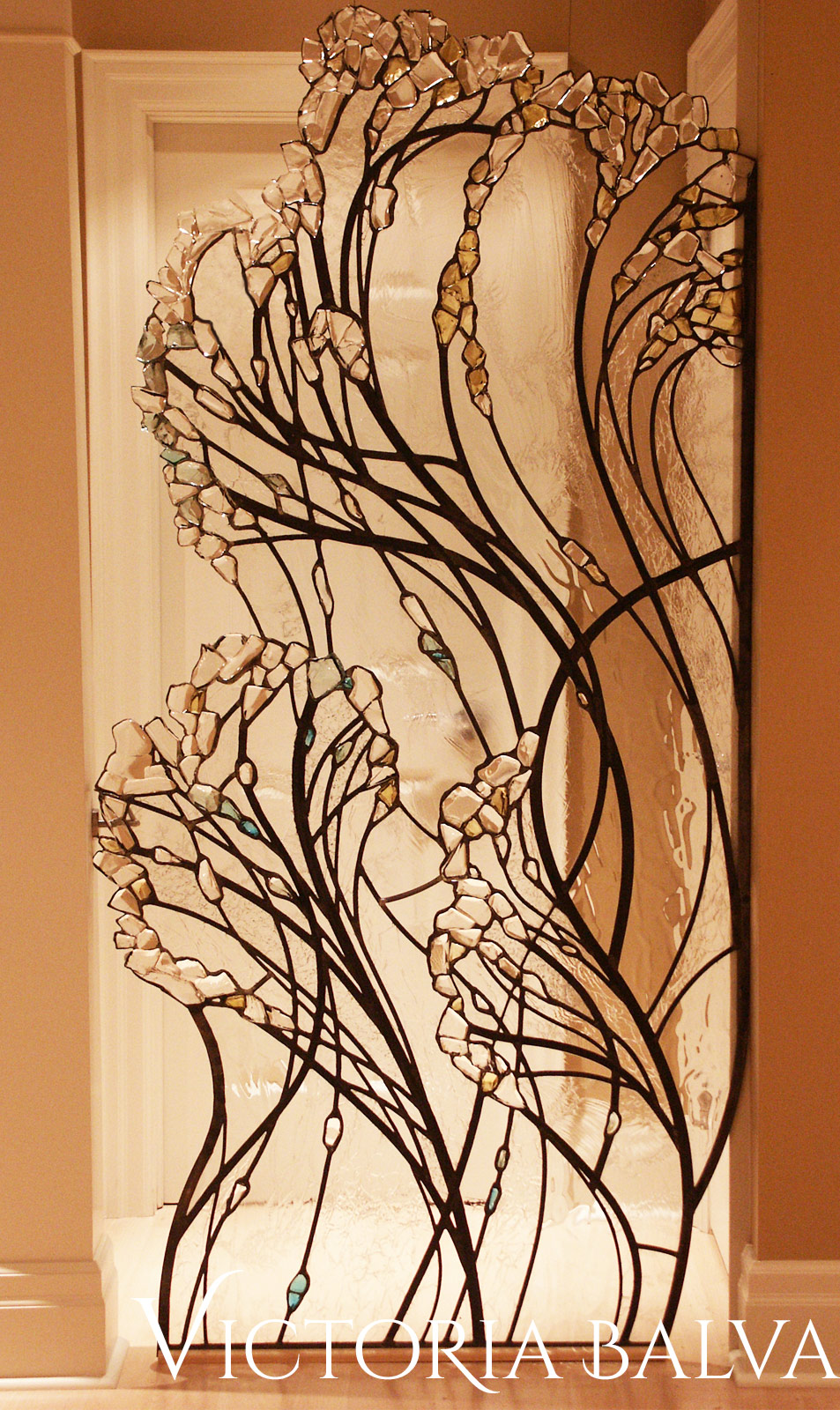 Close up detail of Stained and leaded glass living room divider with kiln formed glass elements